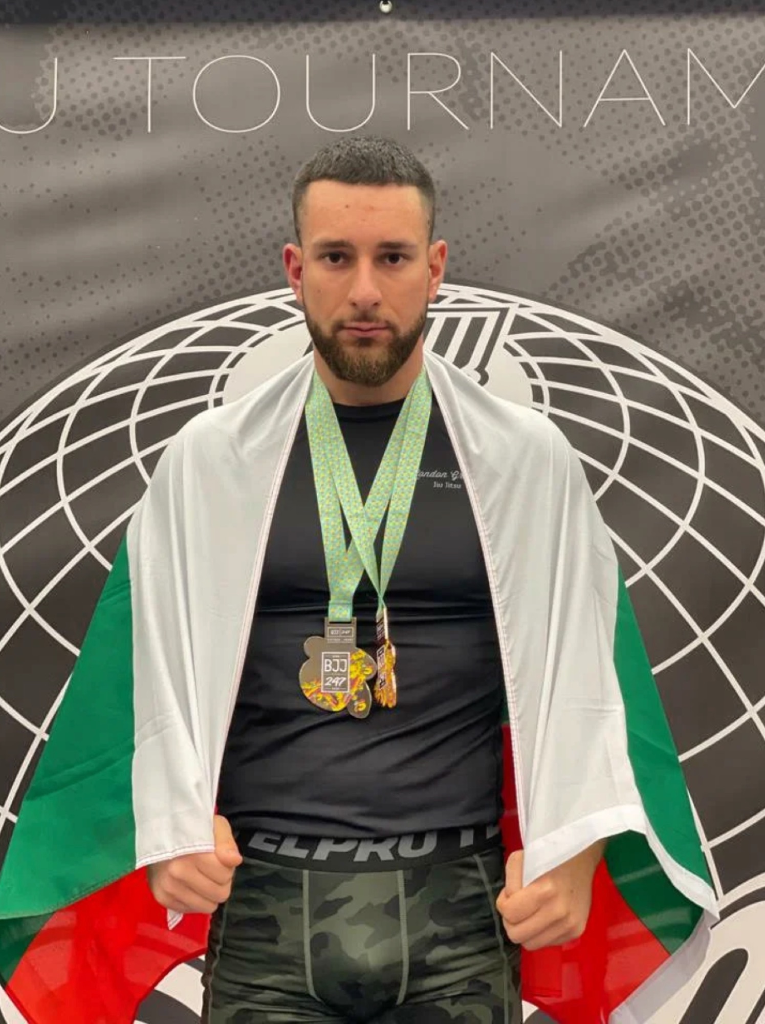 Bozhidar Dimitrov with Bulgarian flag and BJJ medals